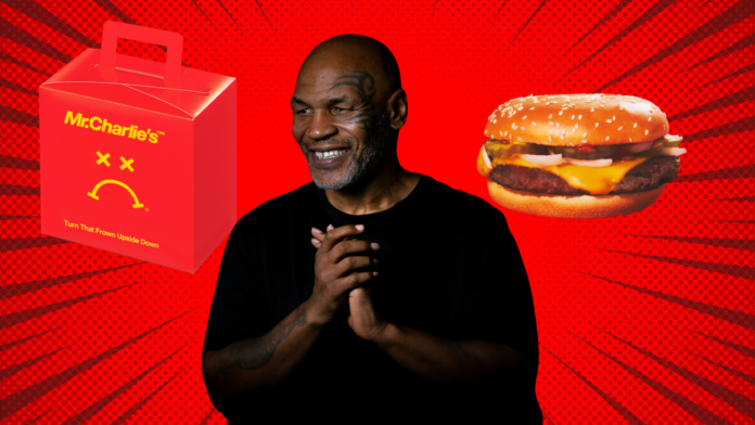 Mike Tyson smiling with hands clasped against red background with Mr. Charlie's burger box and cheeseburger